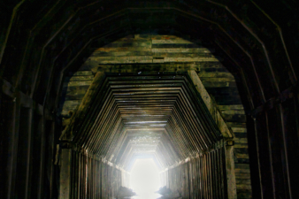 The transition from the larger tunnel to the smaller, more narrow section of tunnel.