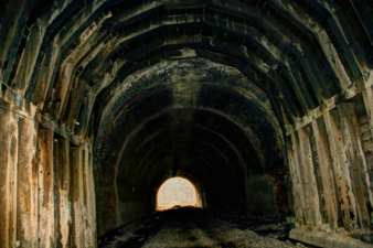 The transition from the wooden section to the bricked section.