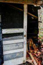 The front screen door of the shack building.