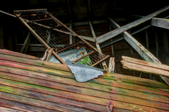 A rusty bed frame used to be on the home's second floor.