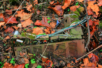 Some sort of electronic item in front of the large house.