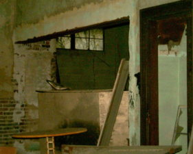 The entry to the back room was partially blocked by a large wooden crate.