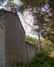 The east side of the house was lined with boarded windows.
