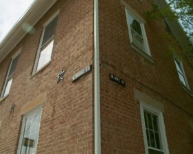 You can tell a building is old when it was used to place road signs.