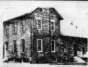 A very old photo of the Harrison House before the stars were added to the front of the building.