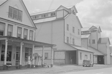 The Hartman Farm General Store and Harness Shop also sold Sohio gasoline. The grain and corn elevators were next door.