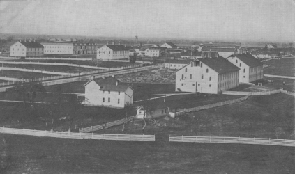 A photo of Hartman Farm's livestock barns, circa 1910.