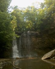 The waster was a good depth at the base of the falls but was very shallow near the large rock.