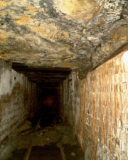 This section of tunnel was supported by wood planks instead of brick. Just ahead was where the tunnel had collapsed years ago.