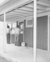 Two Junction City Prison inmates washing the honor camp's cabin in 1958.