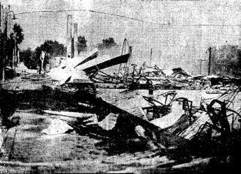 The smoldering ruins of the original prison after the devastating fire in 1928.