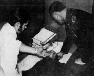 The state highway patrol checks on one of the inmates shot during a hostage situation in 1974.