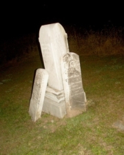 Two tombstones leaned against the stone for William Hoover (1816-1892).
