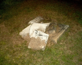 A few of the broken markers at the rear of the cemetery.