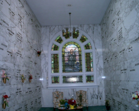 A couple of chairs sat beneath the window at the east end of the newer section.