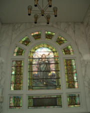 The Tiffany stained glass window of the newer section.