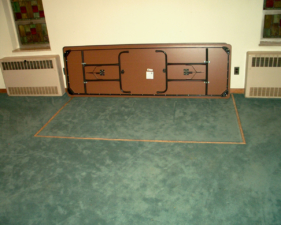 We believe this is a trap door used to move the deceased to and from the basement.