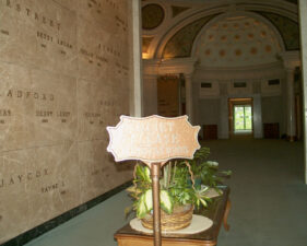 A quiet sign stood to welcome visitors to the mausoleum.
