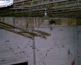 The basketball backboard was missing the hoop.