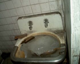There was a huge block of ice in the sink of this restroom.