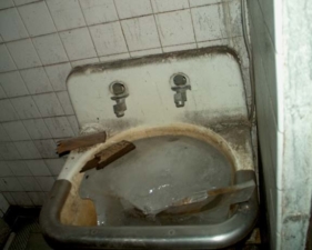 There was a huge block of ice in the sink of this restroom.