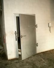 A very large freezer door. This was probably where the frozen pizzas were stored.