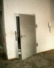 A very large freezer door. This was probably where the frozen pizzas were stored.