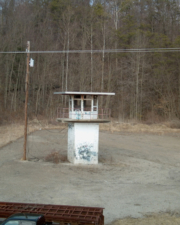 Looking out of the third floor window to the guard tower across the street.