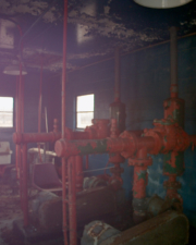 Inside what looked to be either a pump house or sewage treatment facility.