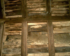 One of the holes in the wall exposed the rock behind it.