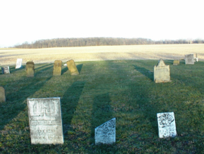 Standing at the center of the cemetery. Peter Stimmel's tombstone is the white stone on the left. He was born in 1790 and died in 1844.