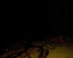 The muddy pavement at the end of Lick Road.