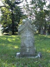 This tombstone from 1864 belonged to Georgia. It was one of the more unique tombstones in the cemetery. We thought those were skulls on top of the tombstone from a distance, but determined they were flowers once we got closer.
