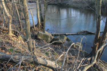 The bridge once spanned where the large rocks lay.