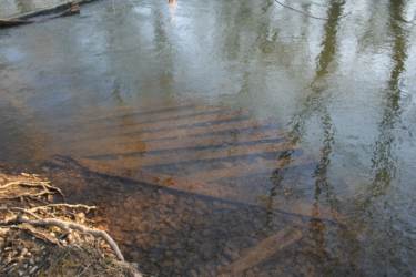 We're not sure why these planks were not taken when the bridge was dismantled.