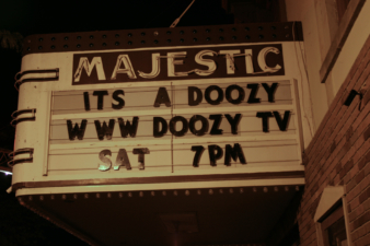 An upcoming show was advertised on the side of the marquee.