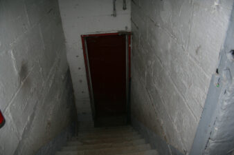 Looking down the stairway to the old boiler room.