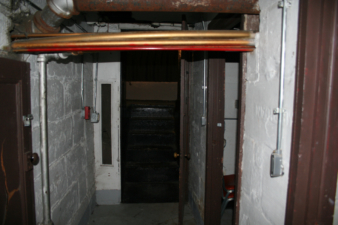 The stairs at the end of the hall go up to the orchestra pit.