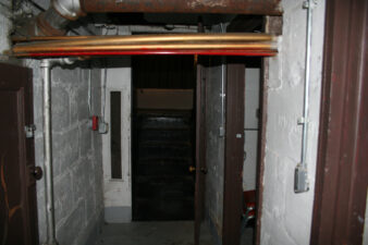 The stairs at the end of the hall go up to the orchestra pit.
