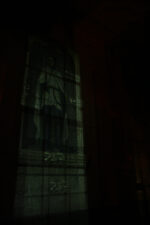 The Knights of the Templar paintings glowed in the dark room.