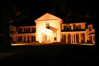The Big House was lit with exterior lighting during the night.