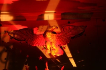 The eagle at the center of the mirror was lit with red light.