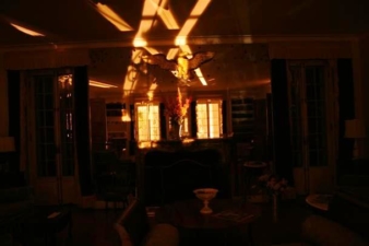 A X pattern formed in the huge mirror of the entertainment room.