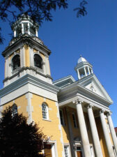 The First Congregational Church was the Northwest Territory's first organized church, chartered in 1796. Using Rufus Putnam's "Two Horn" plan, the church was dedicated in 1809. The first building burned to the ground in 1905 and the church pictured here replaced it in 1906.