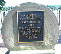 This old grinding stone was dedicated to the first white woman settler, Mary Gardner Owen. She settled in Marietta with her family in 1788.