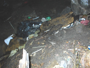 Trash was scattered throughout the floor of the tunnel.