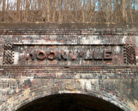 A close-up look at the Moonville sign above the tunnel's entrance.