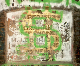 This heavily vandalized plaque states the tunnel was repaired in 1903.