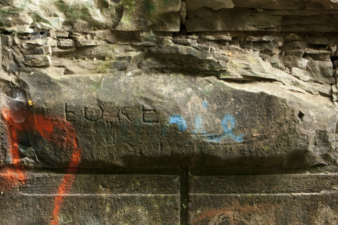 More carvings in the rock foundations just outside the tunnel.