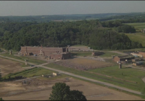 This excerpt from the 1980 Twentieth Century Fox film Brubaker shows a flyby of the prison as it appeared decades ago. The design around the roof were props used for the movie and were removed when filming was complete. Junction City Prison: Brubaker Flyby